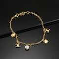 Celine Gold Charm Bracelet with Pearl & Heart Pendants