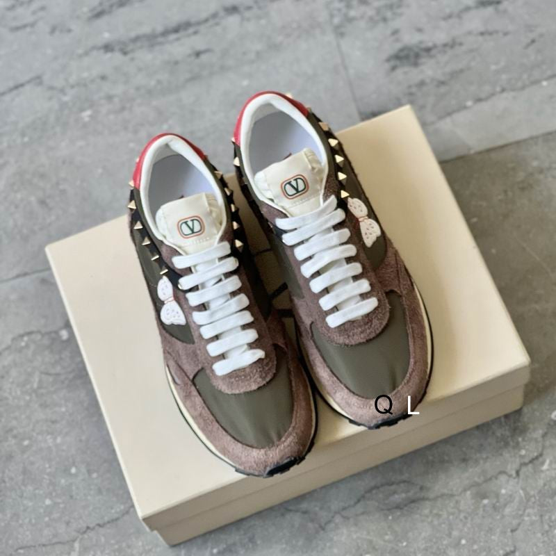 Valentino Garavani Rockstud Run Around Sneakers in army olive and dusty rose, top view on shoe box